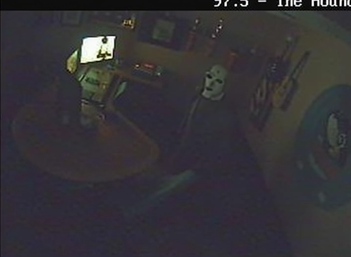 Close surveillance shot of the figure in the house